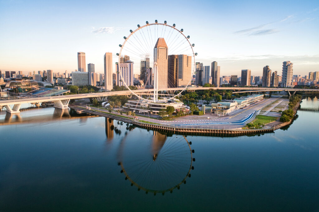 Urban Skyline Ferris Wheel Reflection, Singapore Flyer_original Image of Singapore Skyline. Singapore is a popular fly cruise destination